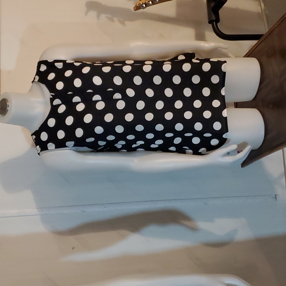 Black and white polka dot sleeveless blouse